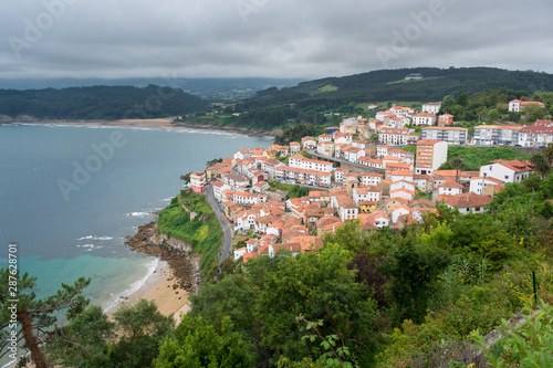 View of lastres a fishermen village in Asturias, Spain. white village houses with red roofs