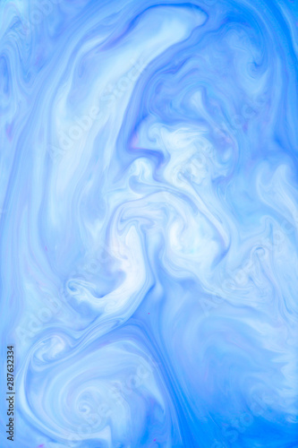 Abstract colored background, fluid design. Stains of paint on the water. Ebru art, marbled paper.