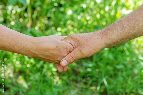 Old people holding hands. Closeup. © photolink