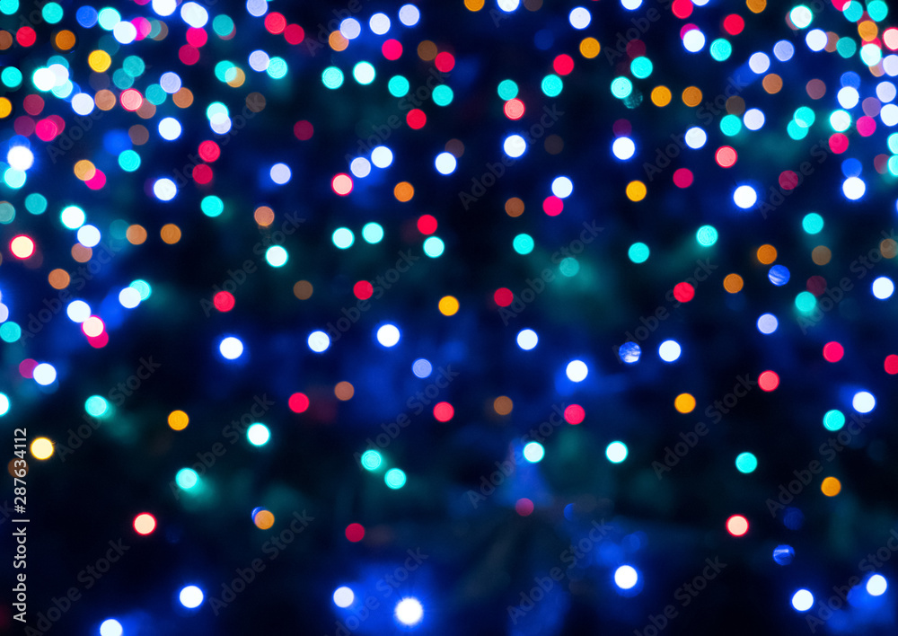 Abstract colorful bokeh texture on dark background