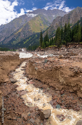 Riverbed after mudflow in the mountains; natural disasters concept