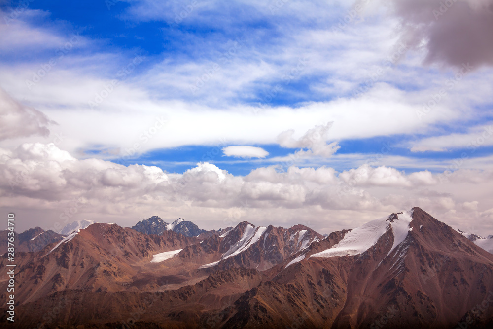 Tian Shan mountain peaks at sunrise. Melting glaciers in a Global Warming Environment, climate change Tian Shan mountain peaks at sunrise. Melting glaciers in a Global Warming Environment, climate change