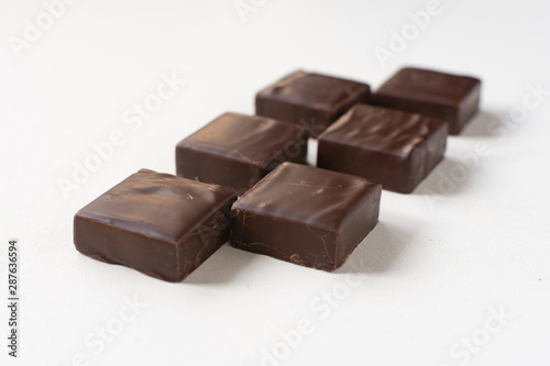Chocolate candies on a white background. © Ph