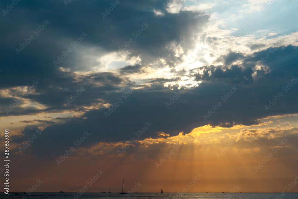 beautiful sunset on the sea against the background of the silhouette of ships,