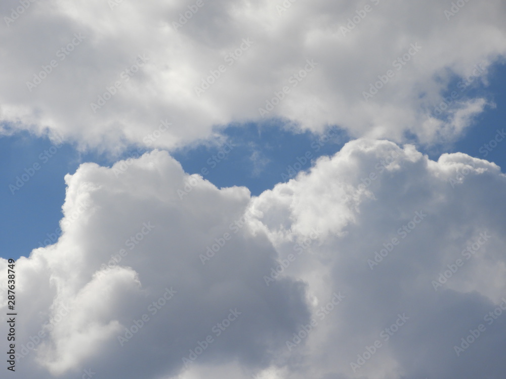 Fluffy clouds zoom shot, day time Fluffy clouds zoom shot, day time