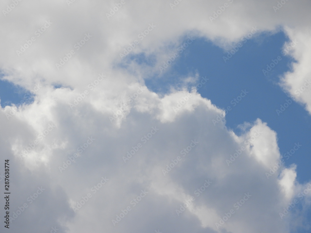 Fluffy clouds zoom shot, day time Fluffy clouds zoom shot, day time