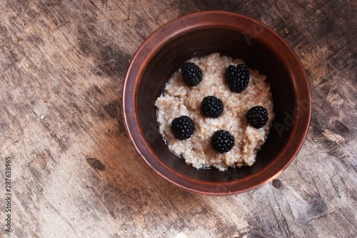 Blackberry oatmeal. View from above. Candid. photo