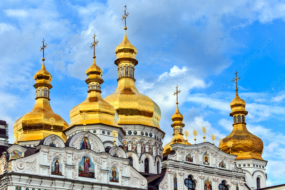 Golden cupolas with crosses of the The Cathedral of the Assumption of the blessed virgin Mary in Kiev Pechersk Lavra Orthodox monastery, Kiev, Ukraine.