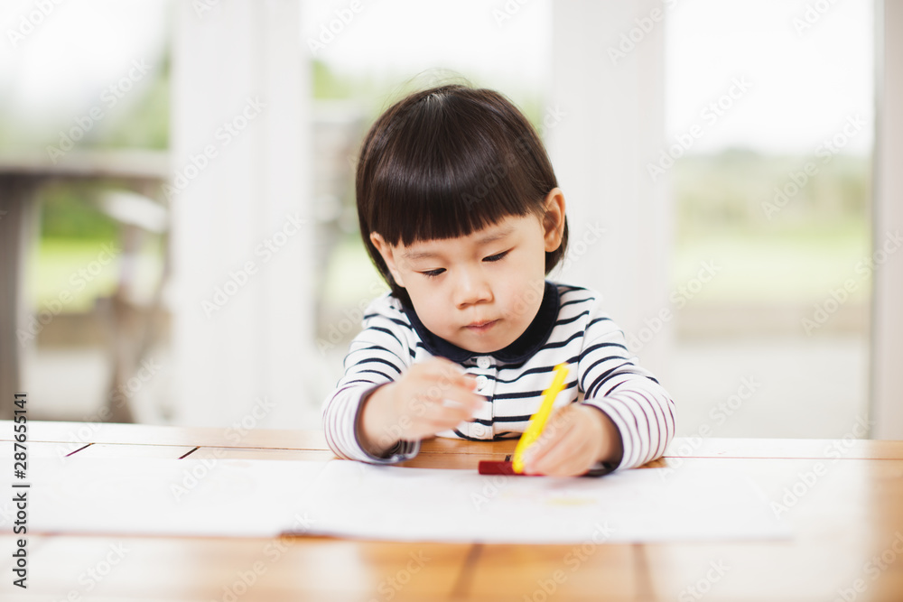 toddler girl paiting on the table at home toddler girl paiting on the table at home