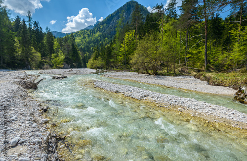 Beautiful landscape scene with forest, mountains and river in Slovenia, Europe. photo