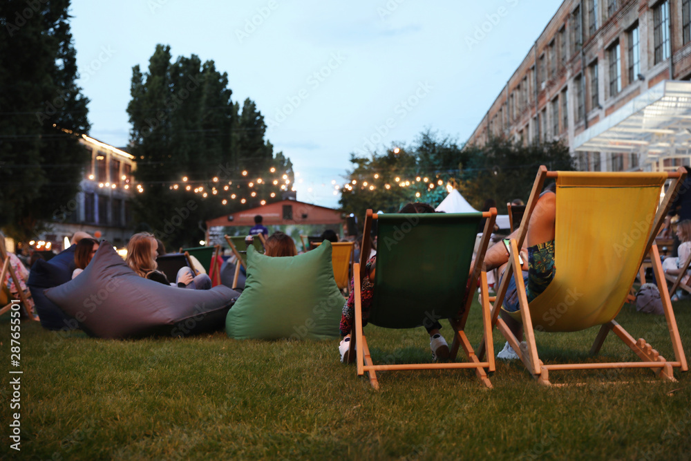 Modern open air cinema with comfortable seats in public park