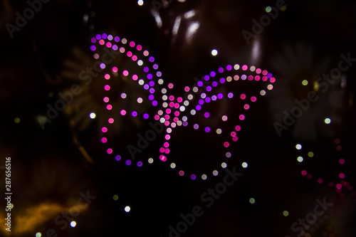 A butterfly formed by LED lights and the Bokeh effect in various colors.