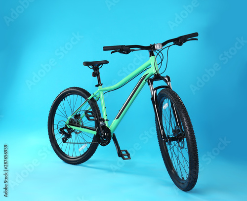 Modern bicycle on blue background. Healthy lifestyle