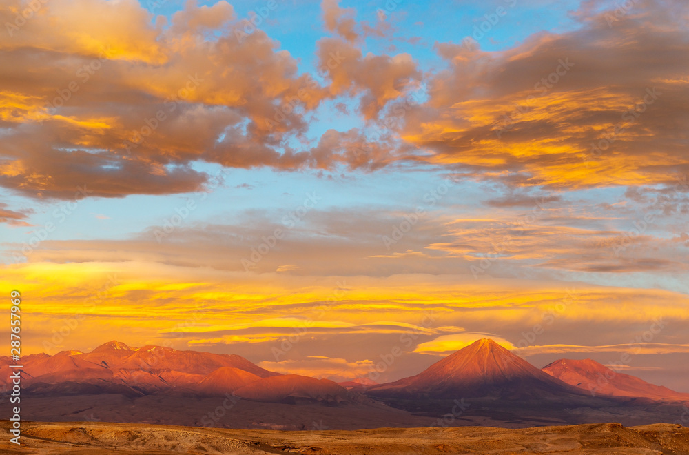 A wonderful sunset in the Atacama desert with its moon landscape and the Licancabur volcano located near San Pedro de Atacama in north Chile.