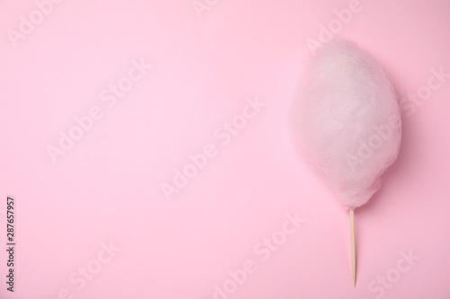 Sweet cotton candy on pink background, top view. Space for text