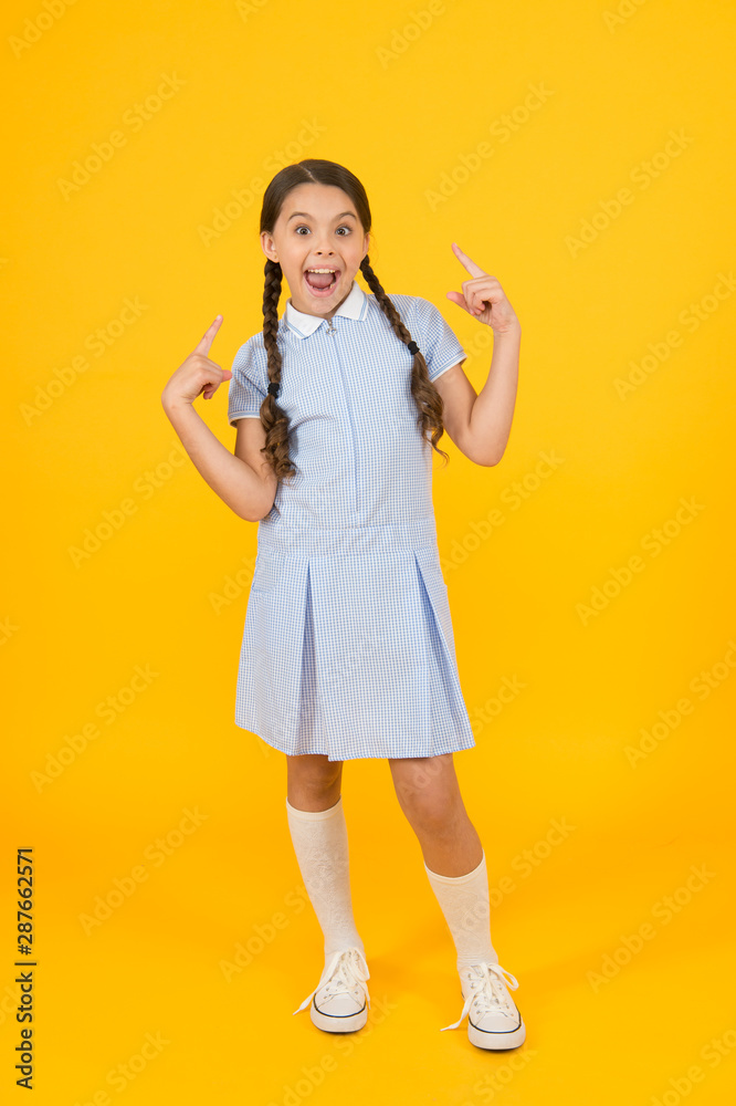 Cute braids. Girl with braided hair style. Hairdresser salon. Tender schoolgirl on yellow background. Tidy hairstyle. Little girl with cute braids. Beautiful braids. Braided hairstyle concept Cute braids. Girl with braided hair style. Hairdresser salon. Tender schoolgirl on yellow background. Tidy hairstyle. Little girl with cute braids. Beautiful braids. Braided hairstyle concept