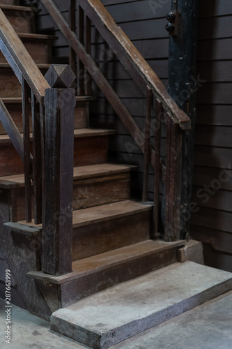 Ancient wooden banister stairs interior vintage decoration in old house