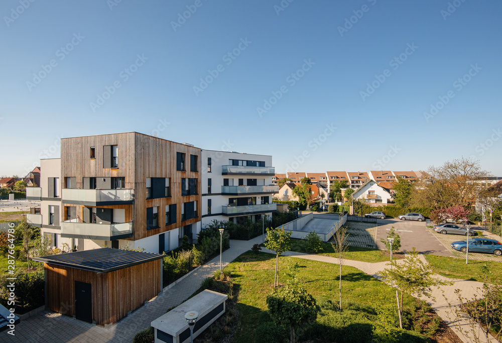 Paris, France - Apr 20, 2019: Modern real estate apartment buildings - elevated view with clear blue sky in background