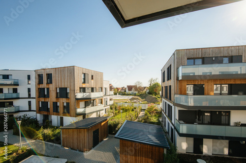 Modern real estate apartment buildings - elevated view with clear blue sky in background