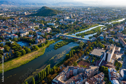 Aerial view of Plovdiv and Maritza river with blue skies and water