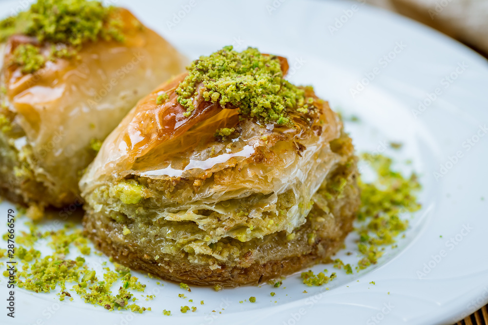 baklava Dilber with pistachios on wooden table. Turkish cuisine