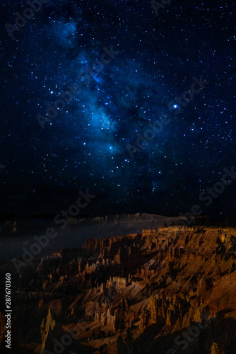 The milky way over bryce canyon national park hoodoos at night