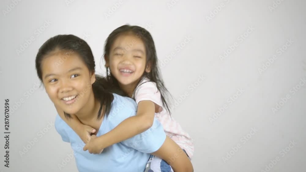 Asian girls siblings are playing fun. Asian girls siblings are playing fun.