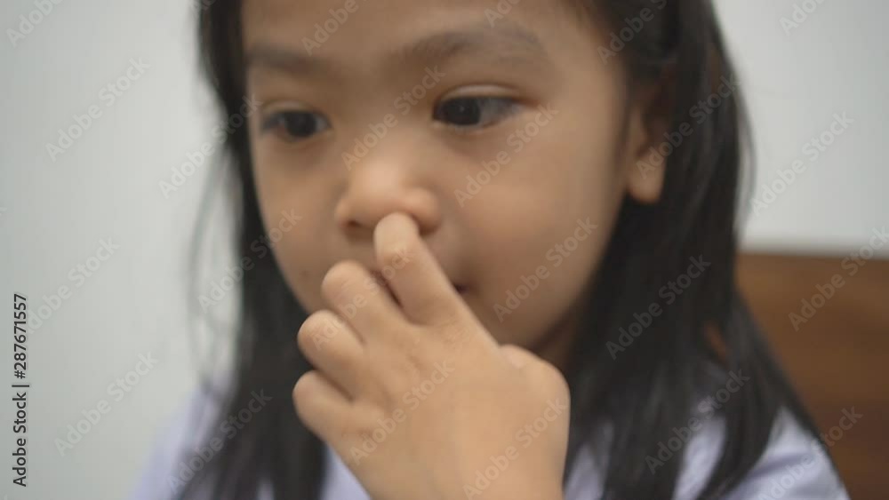 An asian child looking at the camera An asian child looking at the camera
