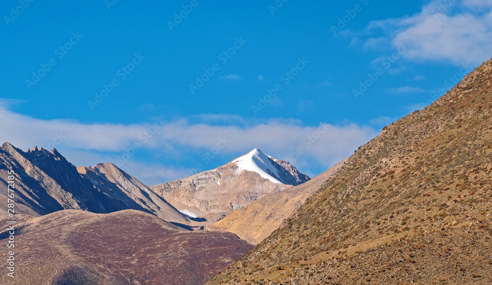 Beautiful tiny snow mountain among mountains in Tibet plateau, China.