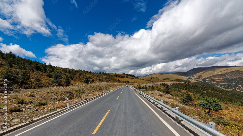 318 National road to Tibet with blue sky and white cloud, most beautiful road for Self-driving travelling.