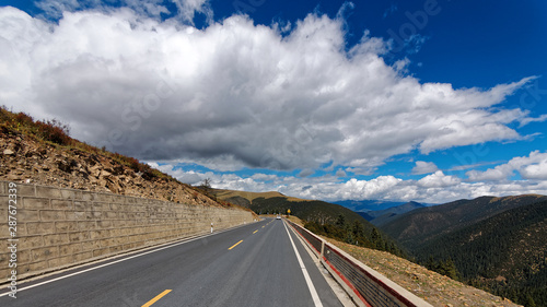 318 National road to Tibet with blue sky and white cloud, most beautiful road for Self-driving travelling.