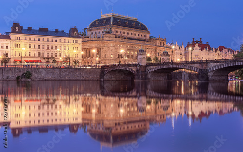 Amazing Prague cityscape with National theatre with reflection from the Kampa island. Very Popular tourist detination in Eurpoe Beautiful old town, jewish quarter and social life.