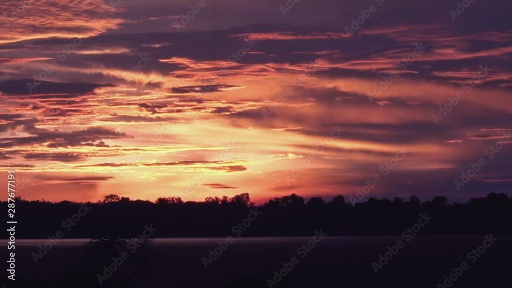 Timelapse of a Beautiful Purple Red and Golden Sunset Over the Lake Timelapse of a Beautiful Purple Red and Golden Sunset Over the Lake
