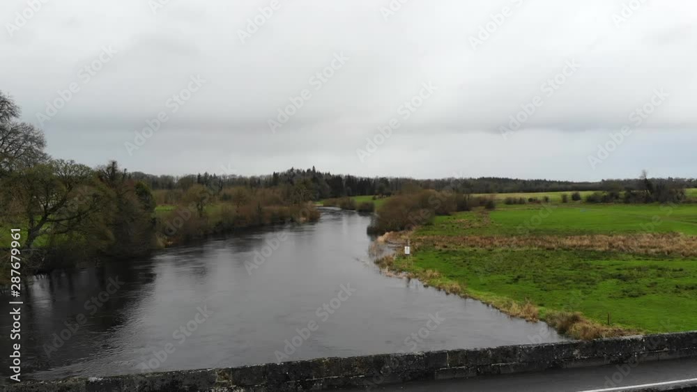 Aerial - Over the river with bridge road for car passing through. Small town of Jamestown, Ireland, Europe. Aerial - Over the river with bridge road for car passing through. Small town of Jamestown, Ireland, Europe.