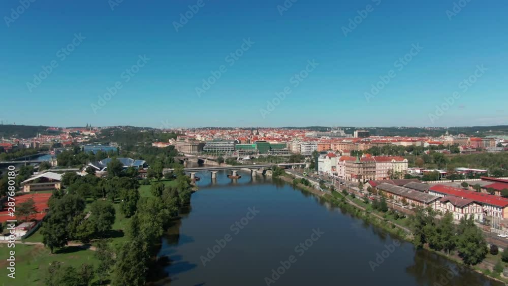 aerial flight over vltava river next to bridges sunny day of summer in Prague aerial flight over vltava river next to bridges sunny day of summer in Prague