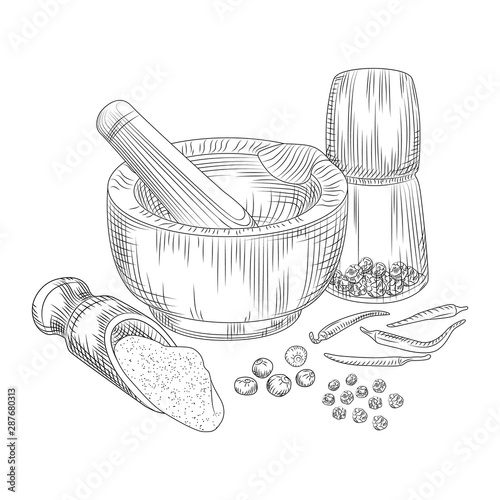 Pepper in a mortar with a pestle. Allspice, black pepper and chili.