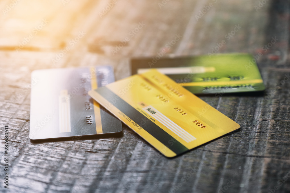 Several credit cards on wooden table Several credit cards on wooden table
