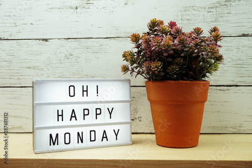 Happy Monday lightbox alphabet wording on wooden background