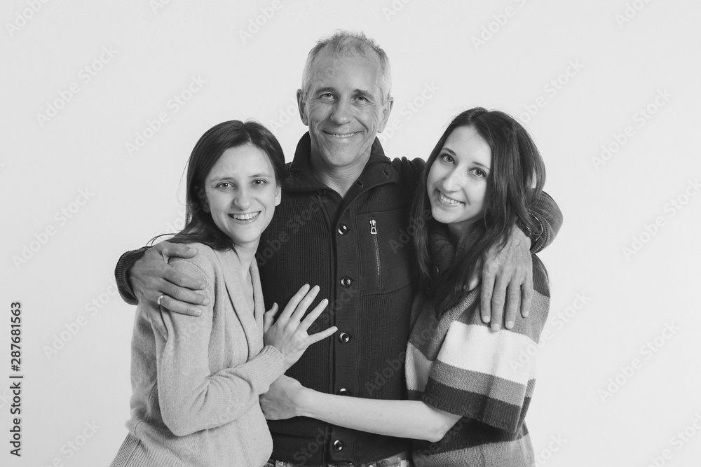 happy man for women. the ladies ' man is surrounded by beauties. Girls hug and kiss the guy. the concept of romantic relationships happy man for women. the ladies ' man is surrounded by beauties. Girls hug and kiss the guy. the concept of romantic relationships
