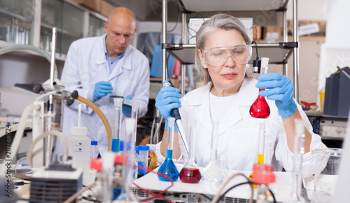 Female chemist mixing chemical agents
