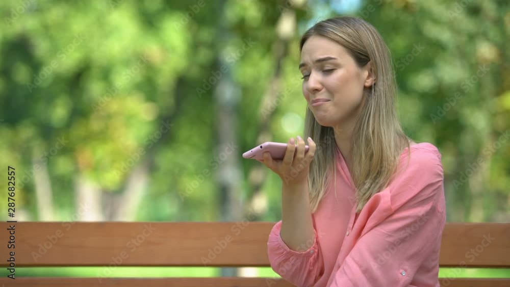 Woman angrily talking phone, having conflict with boyfriend, misunderstanding