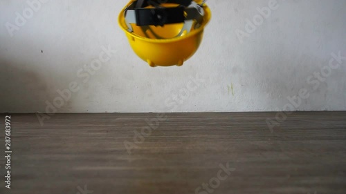 Safety hat falls on the ground
