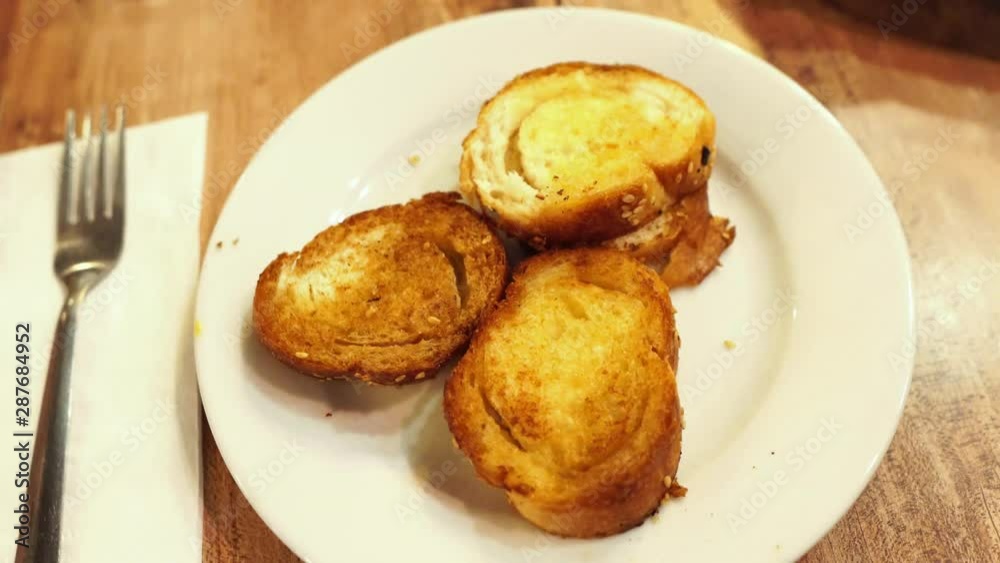 Gourmet toasted bread in restaurant with butter Gourmet toasted bread in restaurant with butter
