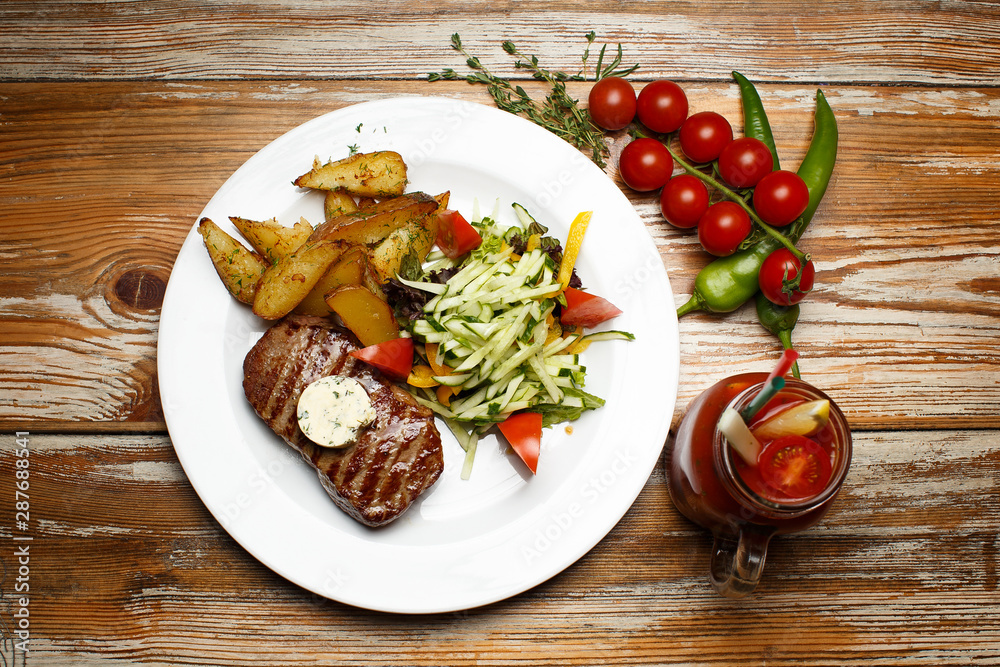 beef steak with potatoes and a vegetables beef steak with potatoes and a vegetables
