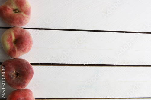 Paraguayan peach on wooden background photo