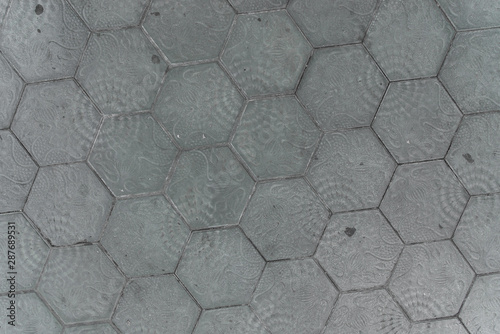 Pattern, texture, and abstract background of a sidewalk pavement tiles