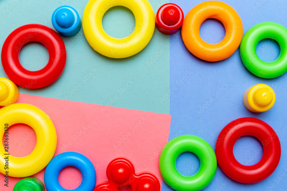 Fototapeta premium Colorful child kid’s education toys pattern background copy space on the bright background. Childhood infancy children babies concept