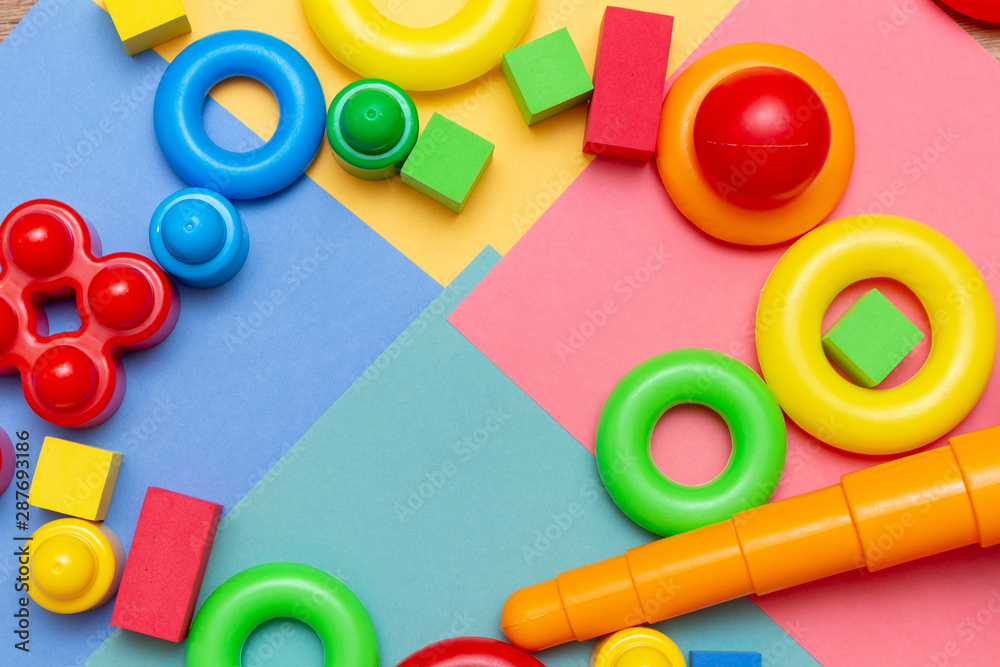 Naklejka premium Colorful child kid’s education toys pattern background copy space on the bright background. Childhood infancy children babies concept