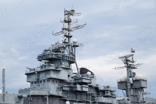 deck of a warship, weapons and communication antennas on the ship. © eleonimages