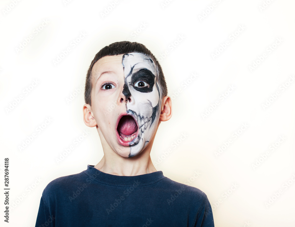 Little cute boy with facepaint like skeleton to celebrate halloween,  lifestyle people concept, children on holiday Stock Photo by ©iordani  361234898